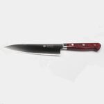 Close-up of Takamura Hamono Gyuto Knife 180mm blade and handle join, highlighting craftsmanship.