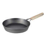 Handle detail of Enzo frying pan showing wood and stainless steel trim