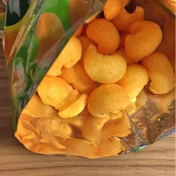 64g Meiji Karl Cheese Curls, light airy texture, designed for Japanese snack lovers