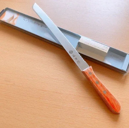 Tojiro Bread Knife 235mm FU-737 cutting through loaf of bread with smooth slices